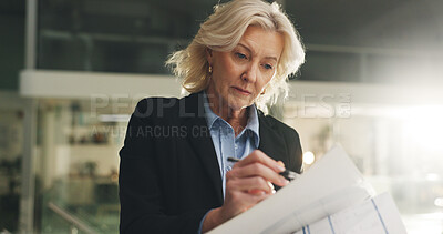 Buy stock photo Documents, reading and businesswoman in office at night with report for investment proposal. Paperwork, deadline and mature female financial manager with planning for company budget in workplace.