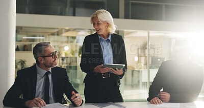 Buy stock photo Boardroom, presentation and tablet with business people in meeting together for company strategy. App, development and flare with mature woman speaking to colleagues in office for management update