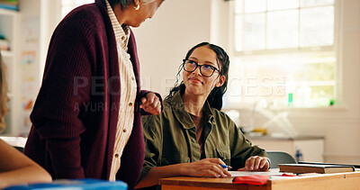 Buy stock photo Teenager, student and teacher helping in classroom for education, lesson assistance and explain quiz. Girl, mature woman and learning support of assessment, problem solving tips and homework feedback