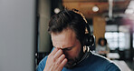Stress, fatigue and call center agent in office with headache for online consultation with error. Burnout, tired and male customer service consultant with migraine for exhaustion in workplace.