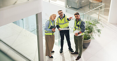 Buy stock photo Planning, architect and group with blueprint in office, talking or teamwork for property development. Civil engineer, woman and men with document for architecture, above and discussion for renovation