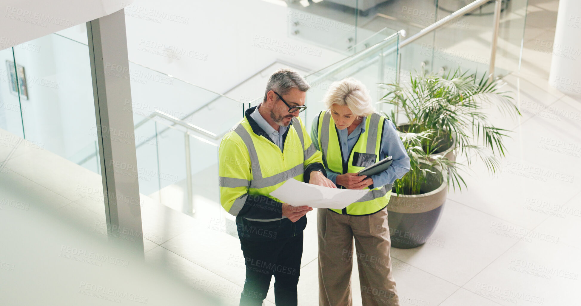 Buy stock photo Real estate, architect and people with blueprint in office, property development or team with ideas. Civil engineer, woman and man with document for architecture, above and discussion for renovation