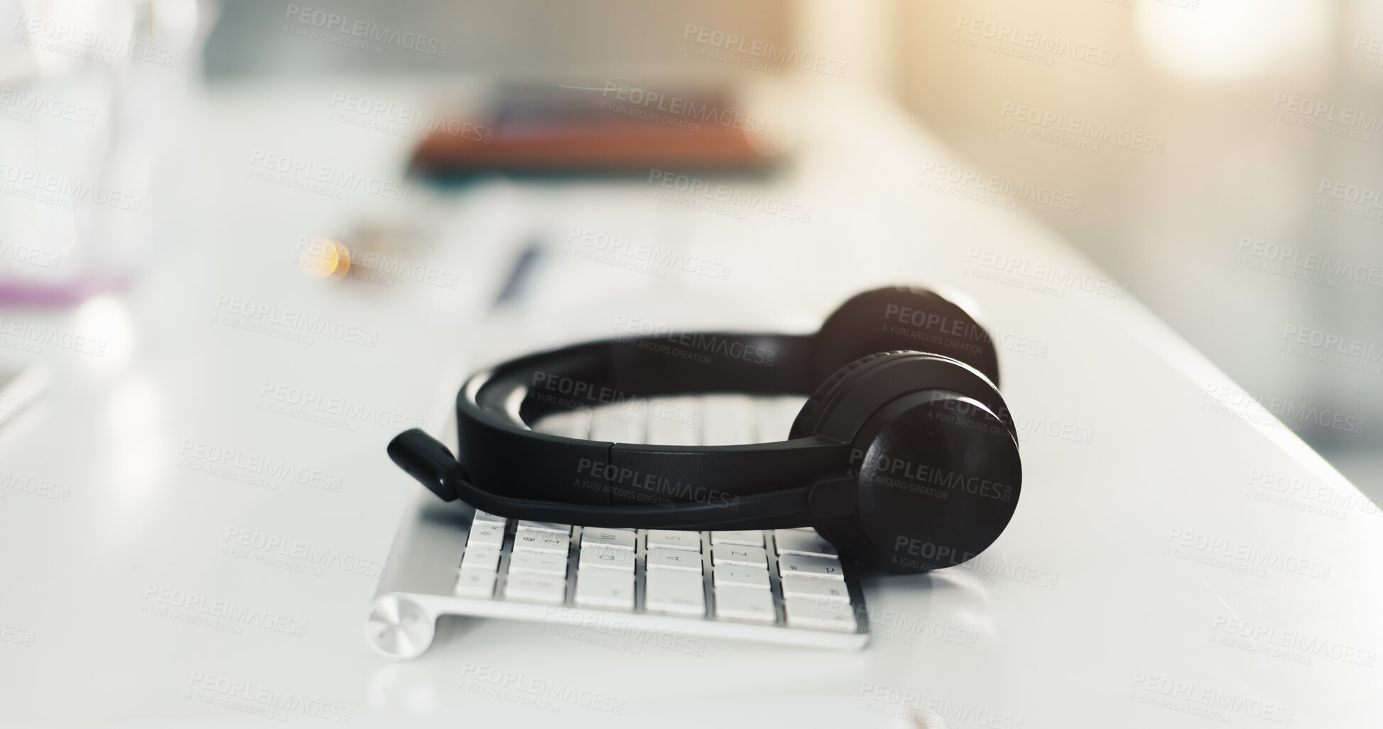 Buy stock photo Call center, keyboard and interior with headset in empty office for virtual assistance, crm and help desk. Communication, contact us and hotline support with headphones in agency for lead generation