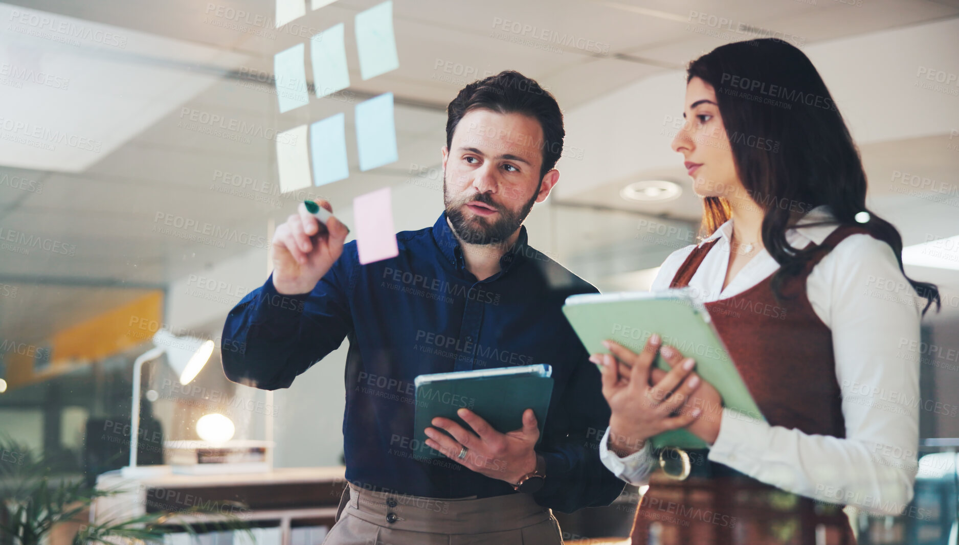 Buy stock photo Business people, writing or planning with tablet on glass board for team brainstorming in office. Businessman, woman or colleagues with technology or sticky note for schedule, tasks or project agenda