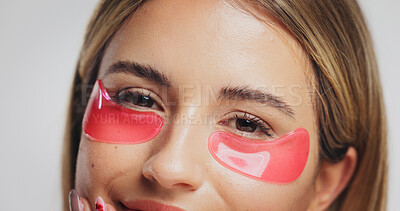 Buy stock photo Eyes, mask and portrait of woman in studio for detox, wellness and beauty on white background. Dermatology, mockup space and face of person with patches for anti aging, collagen benefits and facial