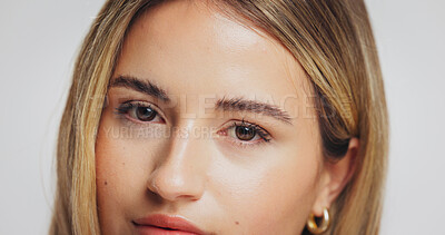 Buy stock photo Portrait, woman and eyes with skincare in studio for beauty, fluffy eyebrows and natural makeup. Female person, cosmetics and facial shine from dermatology, treatment results and white background