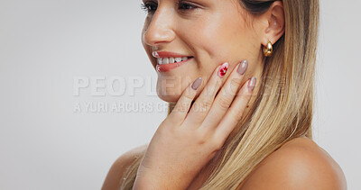 Buy stock photo Happy, hand and woman in studio with nail polish, floral design and trendy style on mockup space. Beauty, smile and female person with manicure, art sticker and creative pattern on white background. 