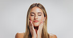 Beauty, woman and touch face in studio for acne treatment results, healthy glow or self care. Mockup space, person and natural makeup on white background with dermatology, skin wellness or anti aging