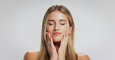 Buy stock photo Beauty, woman and touch face in studio for acne treatment results, healthy glow or self care. Mockup space, person and natural makeup on white background with dermatology, skin wellness or anti aging