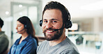 Portrait, call center and agent in office with headphone, telemarketing and technical support for ecommerce. Happy, technology or man in sales with smile, communication or online advice for question.