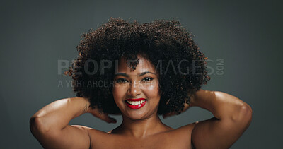 Buy stock photo Hair, portrait and smile of woman on studio space for beauty, cosmetics or makeup satisfaction. Afro, shampoo and volume with happy African model isolated on gray background for haircare results