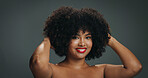 African woman, natural hair and portrait with smile in studio for texture, haircare and cosmetics. Red lipstick, beauty and afro of girl on gray background with shine, moisture and healthy growth