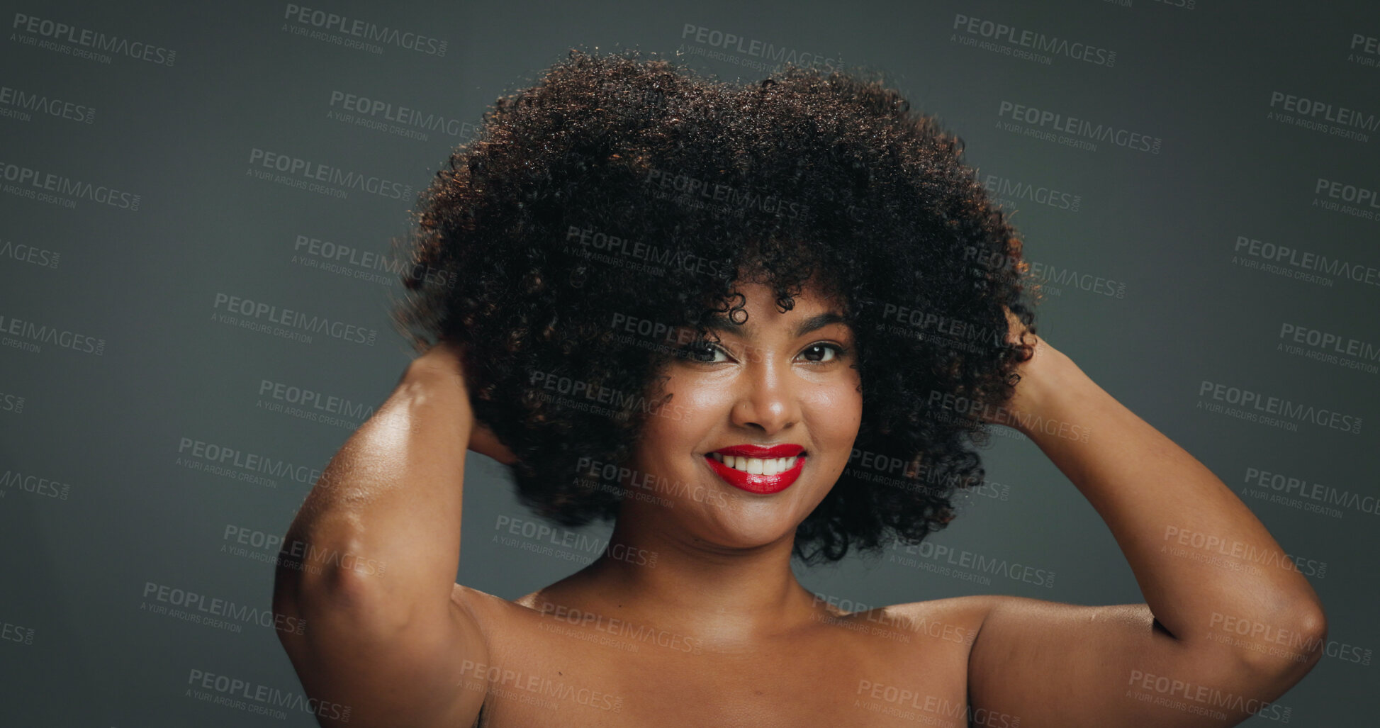 Buy stock photo African woman, natural hair and portrait with smile in studio for texture, haircare and cosmetics. Red lipstick, beauty and afro of girl on gray background with shine, moisture and healthy growth
