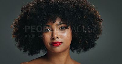 Buy stock photo Portrait, afro and woman in studio with makeup, natural hair and coil maintenance for beauty routine. Cosmetics, self care and African person with volume treatment, growth or shine on grey background