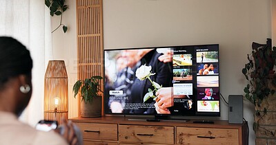 Buy stock photo TV screen, relax and back of woman watching movie, film or show in living room on weekend. Decision, entertainment and female person with choice for online series on streaming subscription in home.