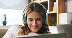 Happy, woman and headphones with tablet at house for streaming, social media and listening to music. Smile, female person and digital for movie search, film audio and playlist sound in living room