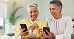 Coffee, laughing and phone with senior friends in living room of home for humor, comedy or visit. App, funny and meme with old women at table together for bonding, joke or reaction to social media