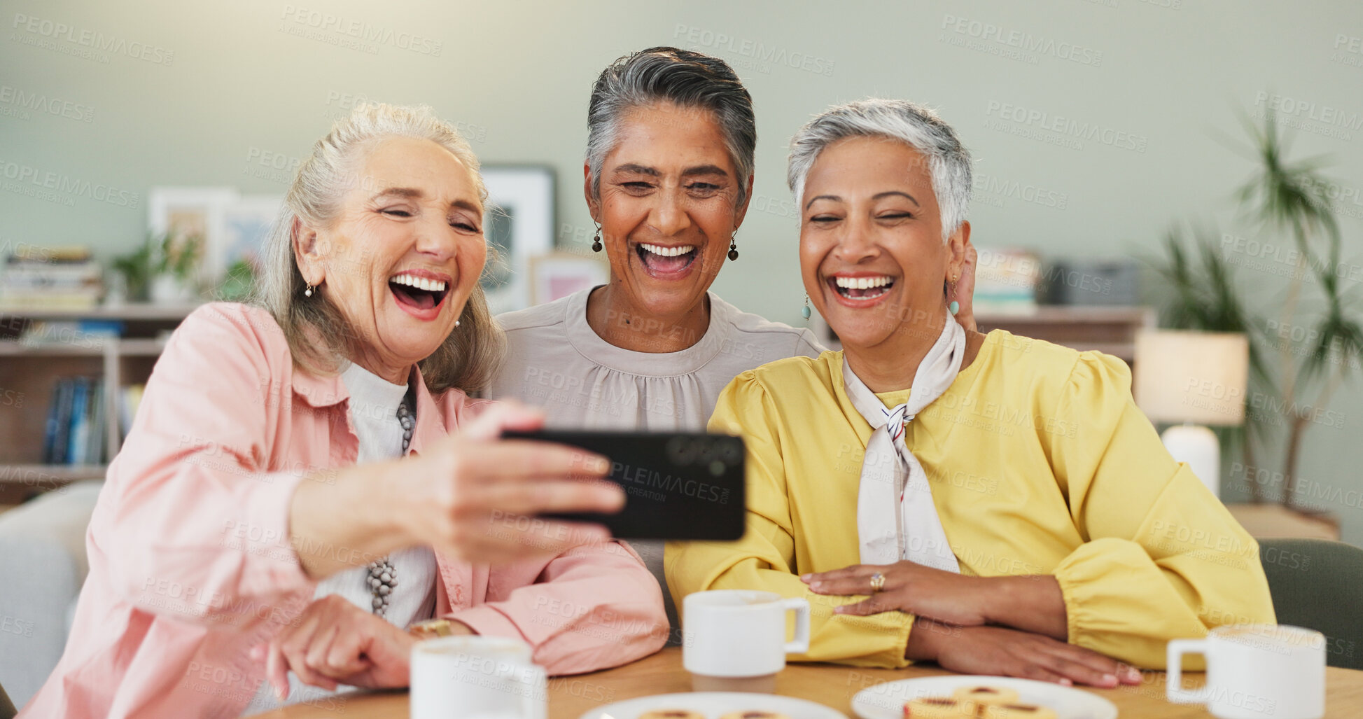 Buy stock photo Selfie, laughing and elderly woman with phone in home, tea party or friendship for happy bonding memory. Cheerful, senior people or picture for retirement reunion with mobile, love and smile together