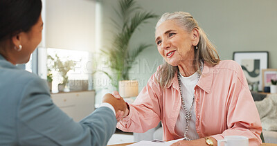 Buy stock photo Senior woman, lawyer and documents with handshake for legal advice, assistance or consultation. Elderly, female person or attorney with paperwork for retirement policy or pension agreement in house