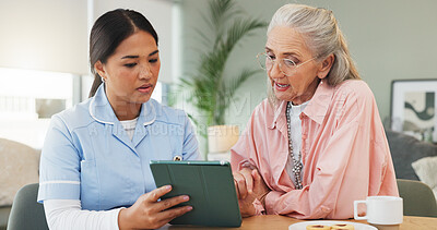Buy stock photo Tablet, nurse and elderly woman in home for conversation, assisted living or check results. Caregiver, senior patient and technology for medical news, healthcare or report at breakfast in retirement
