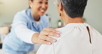 Buy stock photo Hands, nurse and comfort old woman at house for support, assurance and good news of diagnosis. Smile, caregiver and senior person for checkup, medical assistance and compassion with healthcare advice