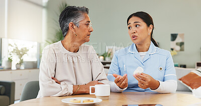 Buy stock photo Pills, nurse and conversation with senior woman for medicine schedule, prescription or healing. Caregiver, drugs and talk to elderly patient for healthcare, medical treatment or retirement in home