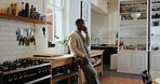 Talk, phone call and happy black man in kitchen for chat, gossip and communication with contact. African person, smile and conversation with mobile for news, update or feedback for connection in home