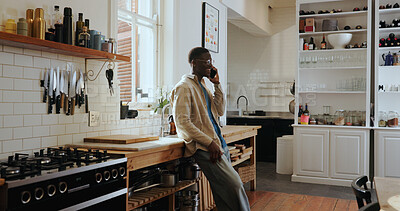 Buy stock photo Talk, phone call and happy black man in kitchen for chat, gossip and communication with contact. African person, smile and conversation with mobile for news, update or feedback for connection in home