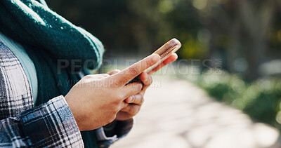 Buy stock photo Park, student and hands with smartphone, texting or communication for upcoming test on social media. Outdoor, space and person with mobile for chat, typing and updates of exam schedule and online