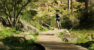 Buy stock photo Running, fitness and woman in forest, training and nature with path, wellness and cardio workout. Outdoor, healthy person and runner with exercise, endurance and challenge with progress and energy