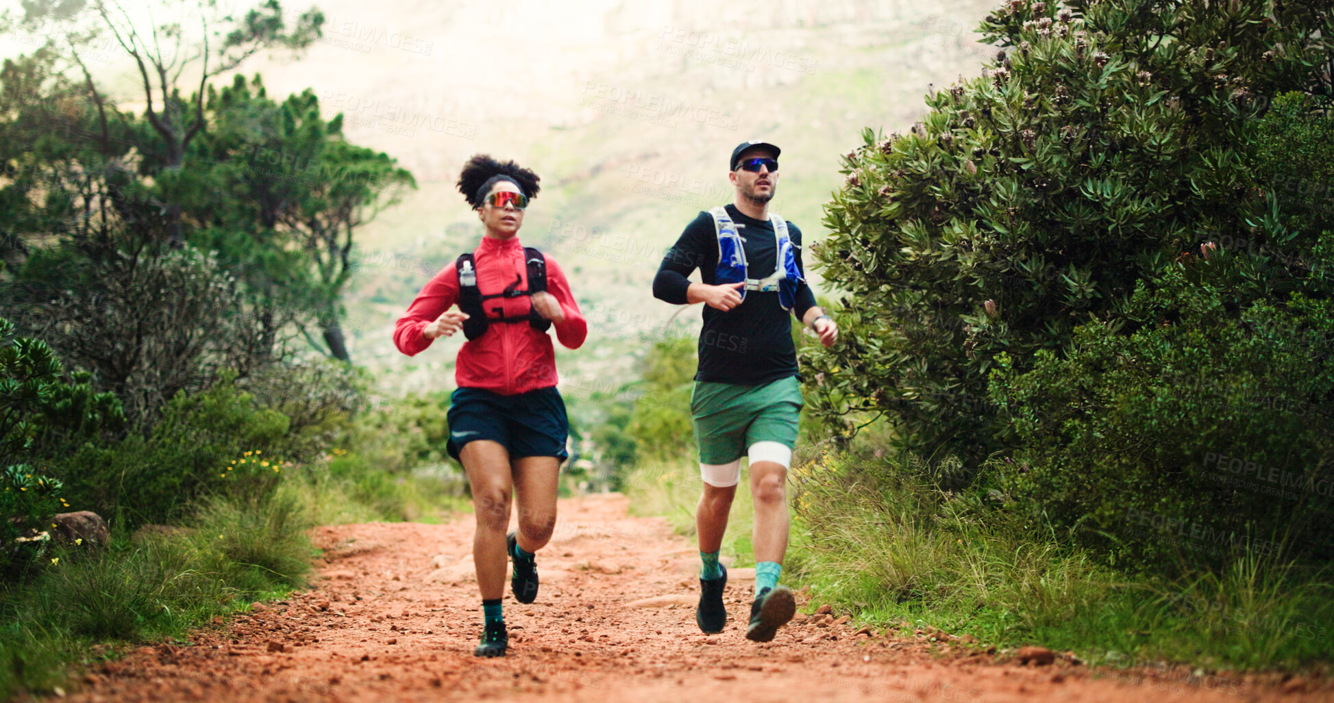Buy stock photo Hiking, running and training with couple in forest together for challenge, performance or workout. Exercise, fitness and space with hiker people outdoor in nature for development, hobby or journey