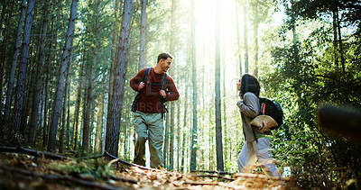 Buy stock photo Hiking, walking and travel with couple in nature for holiday, trekking adventure and bonding. Backpacking date, environment and vacation with man and woman in forest for love, support and hobby