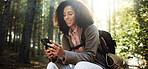 Happy, hiking and woman in forest with phone, online navigation tech and outdoor adventure. Smile, trekking or female person in nature with technology, internet connection or mobile app for location