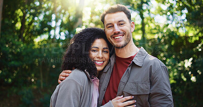 Buy stock photo Happy couple, hug and portrait in forest with hiking, excited and interracial relationship on vacation. Woman, man and smile with embrace outdoor, care and love with trekking adventure on travel