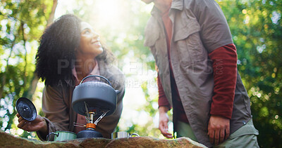 Buy stock photo Camping, kettle and smile with couple in nature for travel destination, coffee break and boiling water. Bonding, brewing tea and low angle with man and woman in forest for trekking adventure