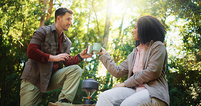Buy stock photo Couple, hiking and coffee break in forest with toast, rest and success on tourism adventure in summer. Man, woman and happy with interracial love, tea cup or goals on holiday for trekking in woods
