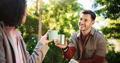 Buy stock photo Couple, hiking and coffee break in woods with toast, happy and success on tourism adventure in summer. Man, woman and travel with interracial love, tea cup or cheers on holiday for trekking in forest