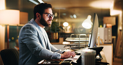 Buy stock photo Night, worry or businessman in office with computer, typing report or reading document for presentation. Overtime, stressed or person with monitor in workplace, deadline or pressure in finance risk

