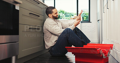 Buy stock photo Man, wrist pain and stress with toolbox in home with carpal tunnel, injury and frustrated with diy project. Person, ache and inflammation on floor with arthritis, burnout and maintenance in kitchen