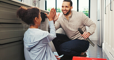 Buy stock photo Girl, father and high five in home with tools on floor for plumbing, success or teaching in kitchen. People, dad and daughter with smile, goals and celebration for diy maintenance at family house