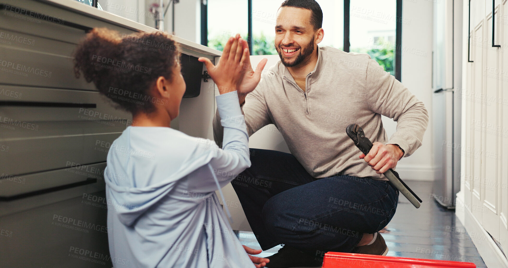 Buy stock photo Girl, father and high five in home with tools on floor for plumbing, success or teaching in kitchen. People, dad and daughter with smile, goals and celebration for diy maintenance at family house