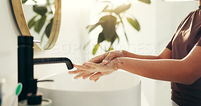 Buy stock photo Basin, soap and washing hands with person in bathroom of home for morning routine or skincare. Cleaning, hygiene and protection with self care in apartment for removal of bacteria, dirt or germs