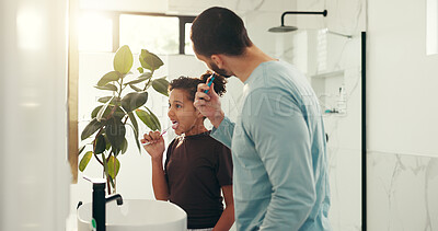 Buy stock photo Child, dad and brushing teeth in bathroom for dental hygiene or morning routine together in home. Father, daughter and toothbrush with mirror or lens flare for clean mouth, fresh breath or oral care