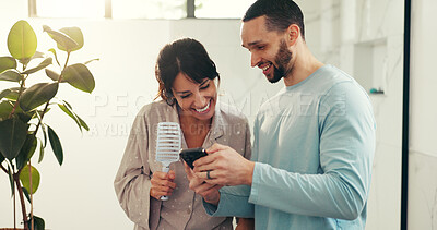 Buy stock photo Bonding, social media and couple in house with phone, follower check or video review on digital platform. Smile, partner and influencer in bathroom with tech, audience count or reaction on mobile app