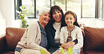 Grandmother, mother and daughter in lounge with portrait, visit or bonding for special memory connection. Happy, people and family in living room with smile, embrace and generations together in home.