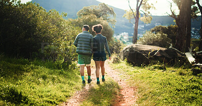 Buy stock photo Back, walking and couple hiking in forest for travel, adventure and bonding together on path. Trekking, man and woman outdoor for trail exploration, fitness and holding hands for support on holiday