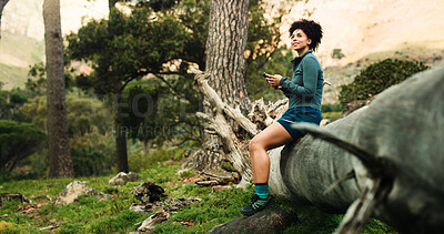 Buy stock photo Hiking, thinking and woman in forest, smartphone and relax with smile, social media and app for maps. Outdoor, person and hiker in woods, break and cellphone with nature, ideas or wonder with network