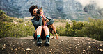Break, hiking or kiss with woman and dog in mountains for adventure, bonding or journey. Cuddle, love or trekking with happy pet owner and puppy on space in forest together for exercise or fitness
