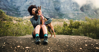 Buy stock photo Break, hiking or kiss with woman and dog in mountains for adventure, bonding or journey. Cuddle, love or trekking with happy pet owner and puppy on space in forest together for exercise or fitness