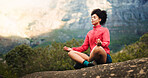Woman, fitness and meditation with rock in nature for zen, inner peace or spiritual wellness. Calm, female person or outdoor breathing exercise in lotus pose for mental wellbeing, chakra or mudra